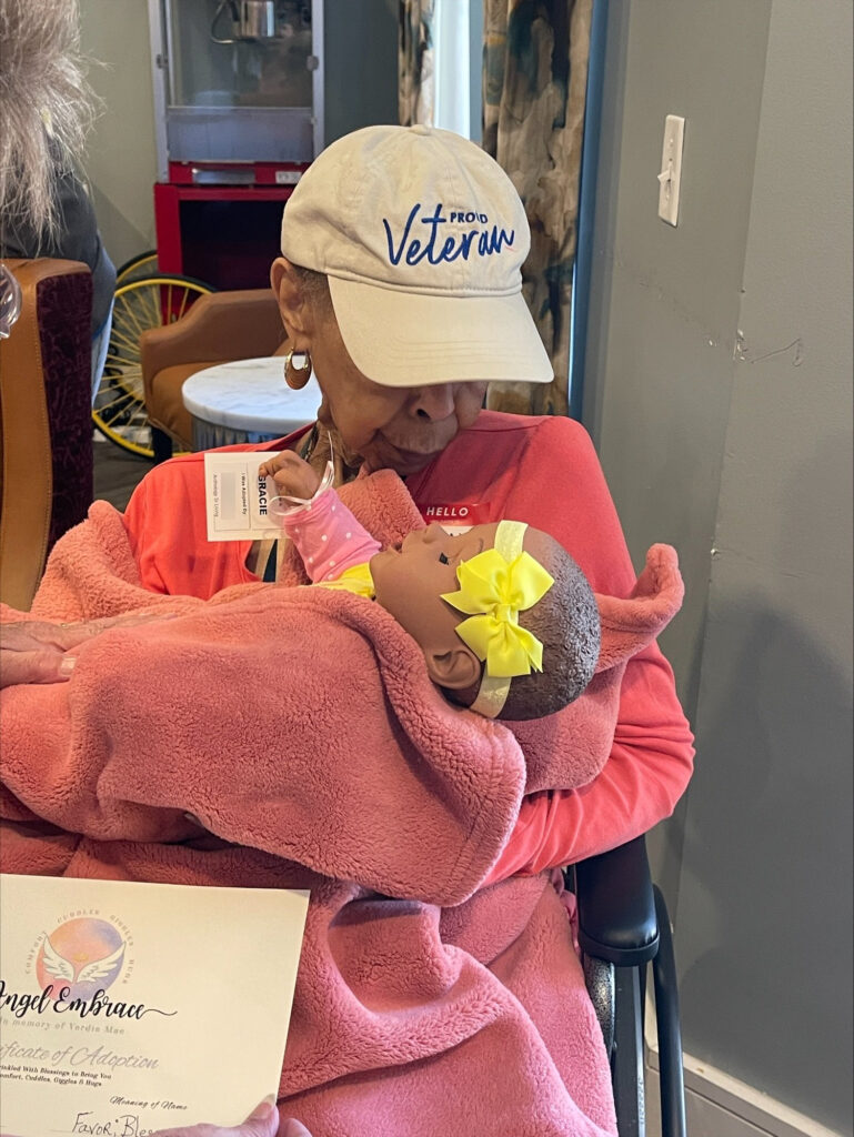 Woman looking at baby in blanket